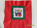 Can I open it now? cross stitch square bordered with green and backed with a red polycotton square. Won in YDC 68 by Penny291